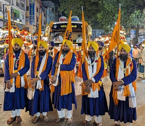 Panj Pyaras carrying Nishan Sahebans as part of the Shaheedi Nagar Kirtan to commemorate 350th martyrdom of Guru Tegh Bahadur Sahib in Hyderabad.