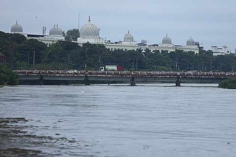 Overflowing Musi River with Salar Jung Museum in the background.