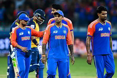 India's captain Suryakumar Yadav (C) walks with his teammates at the end of the Asia Cup 2025 Super Four Twenty20 international cricket match between India and Sri Lanka at the Dubai International Stadium in Dubai on Friday
