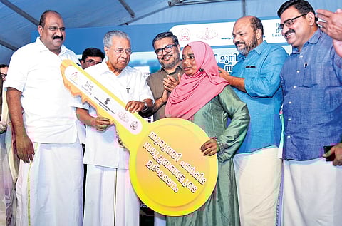 Chief Minister Pinarayi Vijayan inaugurating the Thuruthy housing complex at Fort Kochi on Saturday. Ministers M B Rajesh and P Rajeeve, MLA K J Maxi and Mayor
M Anilkumar are also seen.