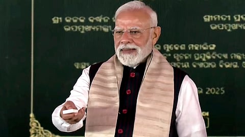 Prime Minister Narendra Modi during the foundation stone laying and inauguration of various development projects at a public rally, in Jharsuguda, Odisha, Sept. 27, 2025.