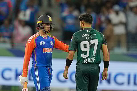 India's Abhishek Sharma talks to Pakistan's Haris Rauf during the Asia Cup cricket match between India and Pakistan at Dubai International Cricket Stadium, United Arab Emirates, Sunday, Sept. 21, 2025.
