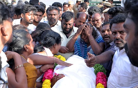 Bereaved family members and relatives of victims, who died after a stampede at actor-politician Vijay's rally on Saturday, mourn outside the mortuary at the Government Hospital, in Karur district, Tamil Nadu, Sunday, Sept. 28, 2025.