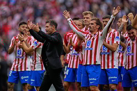 Atletico Madrid players celebrate at the end of the Spanish La Liga soccer match between Atletico Madrid and Real Madrid at Metropolitano stadium, in Madrid, Spain, Saturday, Sept. 27, 2025.