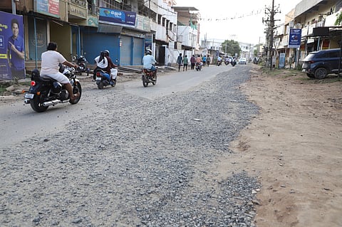 Motorists struggle to navigate the damaged roads in Coimbatore.