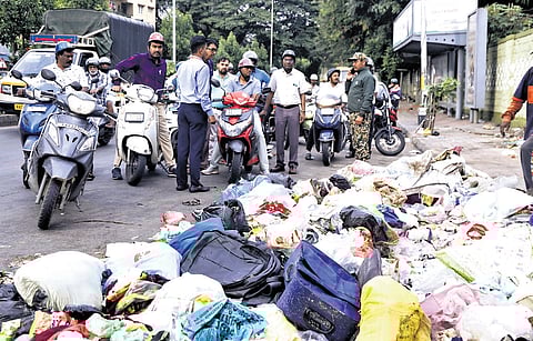 Bengaluru Central City Corporation Commissioner Rajendra Cholan inspects a road strewn with a pile of garbage, in the Chickpet Division, on Monday.