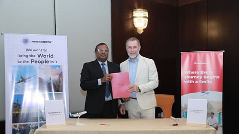 brahim Iyas, Managing Director of Maldivian, signing the pact with Marcelo Kaiser, COO (Aviation) at AVIAREPS on Tuesday