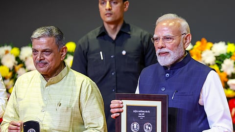 Prime Minister Narendra Modi and Rashtriya Swayamsevak Sangh (RSS) Sarkaryavah Dattatreya Hosabale during the centenary celebrations of the RSS, in New Delhi.