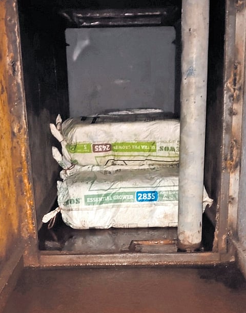 A search uncovered 561 packets of the suspected substance hidden in a secret compartment within the truck.