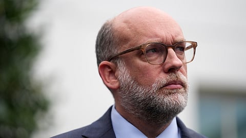 Russell Vought, Office of Management and Budget director, listens as he addresses members of the media outside the West Wing at the White House in Washington, Monday, Sept. 29, 2025, in Washington.