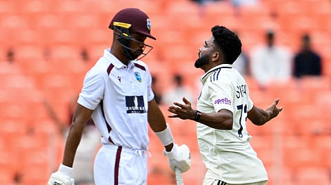 India's Mohammed Siraj (R) celebrates the wicket of West Indies' captain Roston Chase on Thursday