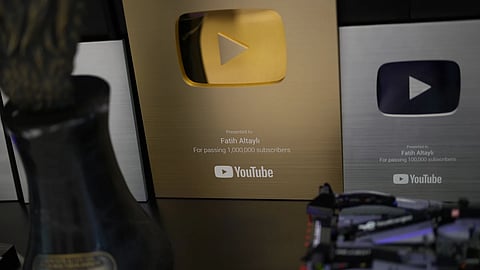 Plaques are displayed at the Teke Tek Medya news agency where imprisoned Turkish journalist Fatih Altayli continues to deliver comments on his YouTube show through letters read by his assistant, in Istanbul, Wednesday, Oct 1, 2025.