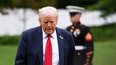 US President Donald Trump walks from Marine One after arriving on the South Lawn of the White House, Tuesday, Sept. 30, 2025, in Washington.