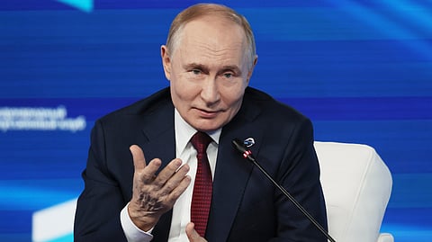 Russian President Vladimir Putin gestures as he answers questions during a meeting with foreign policy experts at the Valdai Discussion Club in the Black Sea resort of Sochi, Russia, on Thursday, Oct. 2, 2025