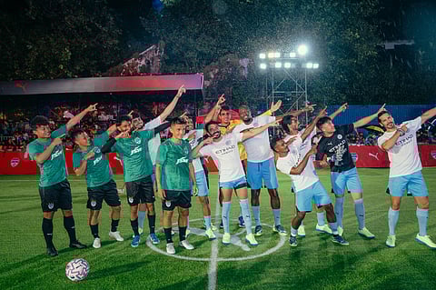 Usain Bolt (centre) and India football ace Sunil Chhetri along with rest of the participants during the exhibition match on Friday