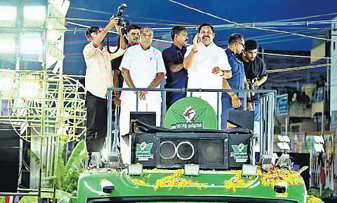 AIADMK general secretary Edappadi K Palaniswami addressing a gathering in Palacode, Dharmapuri; (inset) a banner welcoming EPS put by a TVK worker in Harur