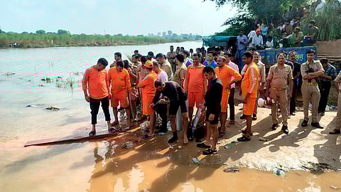 Rescue operations at Kheragarh during Durga Puja immersion, in Agra, Uttar Pradesh, Friday, Oct. 3, 2025.