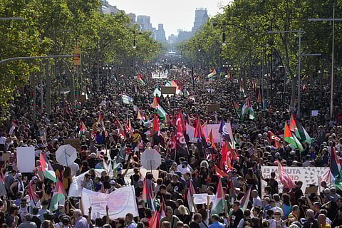 Pro-Palestinian demonstrators rally during a protest in Barcelona, Spain, Sunday, Oct 4, 2025, in solidarity with the Global Sumud Flotilla after ships were intercepted by the Israeli navy.