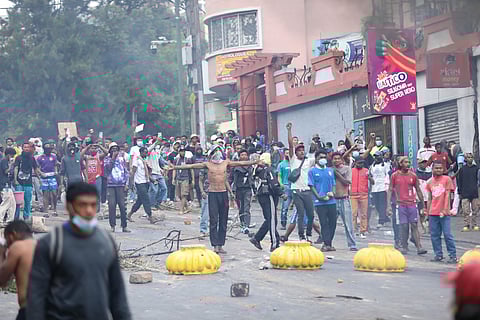 Demonstrators protesting against chronic electricity and water cuts confront riot police in Antananarivo, Madagascar, Tuesday, Sept. 30, 2025.