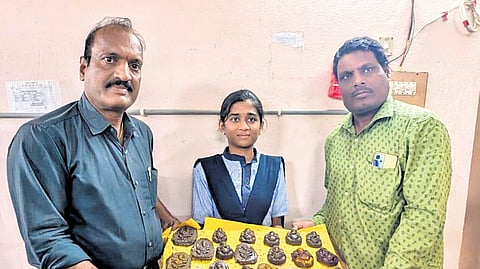 Pesara Prabhakar Reddy (extreme left) showcases clay idols prepared as part of an environmental awareness initiative