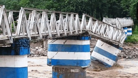 Damaged roads and structures buried under debris after landslides due to heavy rainfall, in Darjeeling district, West Bengal, Sunday, Oct. 5, 2025.