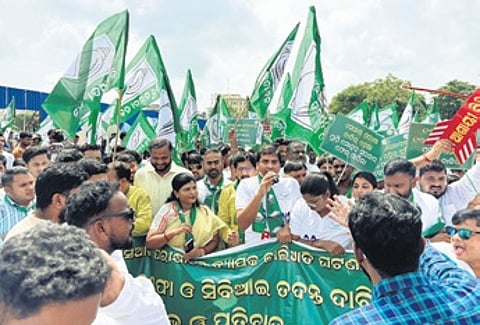 BJD leaders and activists staging a protest on Monday