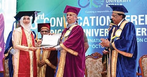 Governor Rajendra Arlekar felicitating a student at the convocation ceremony at Digital University Kerala in Thiruvananthapuram on Monday