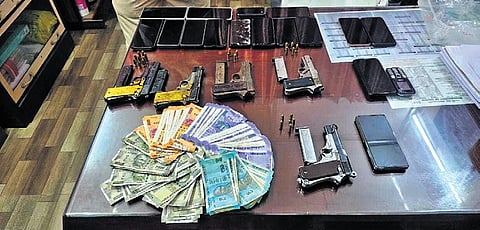 Illegal firearms and other items seized from the 15 accused.