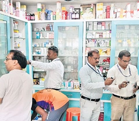 Drug officials checking stocks at a medicine store in Berhampur.