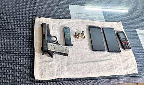 Police seized a country-made pistol, one magazine, four live ammunition, three blank cartridges and as many mobile phones from their possession.