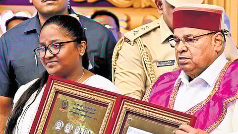 Prema S receives 11 gold medals in MA Kannada from Governor Thaawarchand Gehlot at the Bangalore University Convocation on Wednesday
