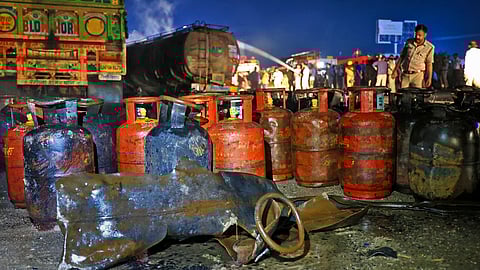 Charred LPG cylinders placed at the site after a truck carrying the cylinders caught fire following a collision with a tanker on the Jaipur-Ajmer highway, early Wednesday, Oct 8, 2025