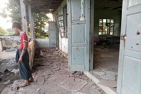 This UGC photo courtesy of Facebook user Yebaw Hlyat Cee taken on October 7, 2025 and received on October 8, shows damage to a building next to the site of a military strike on a protest in central Myanmar's Chaung U township.