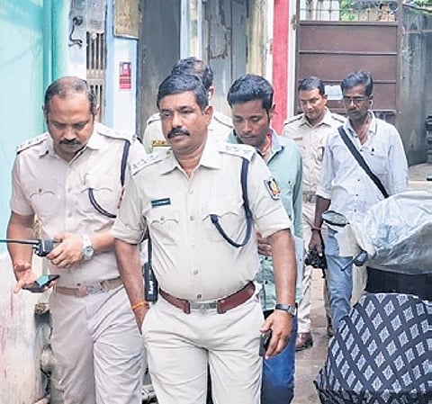 Police conducting raids at Hatipokhari locality in Cuttack on Thursday.