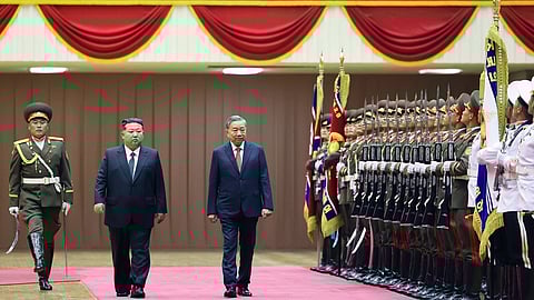 North Korean leader Kim Jong Un, second left, and Vietnamese General Secretary of the Communist Party To Lam, third left, review honor guards during a welcome ceremony for Lam's state visit in Pyongyang, North Korea, Thursday, Oct. 9, 2025.
