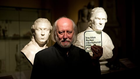 Hungary's Laszlo Krasznahorkai poses for photographers in London, Tuesday, May 19, 2015.