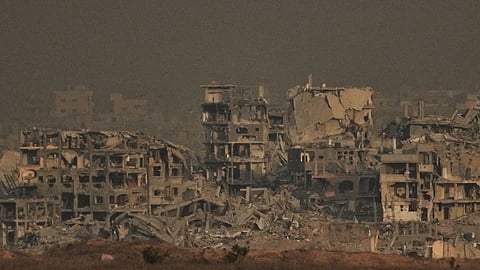 Buildings that were destroyed during the Israeli ground and air operations stand in the northern Gaza Strip, as seen from southern Israel, Thursday, Oct. 9, 2025, following the announcement that Israel and Hamas have agreed to the first phase of a peace plan to pause the fighting.
