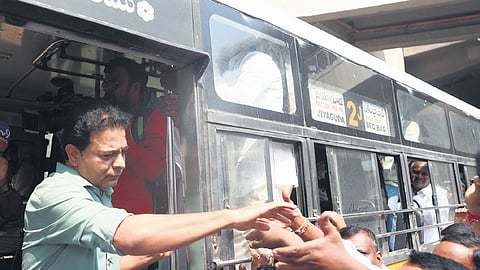 BRS working president KT Rama Rao gets down from a bus at RTC ‘X’ Roads in Hyderabad on Thursday.