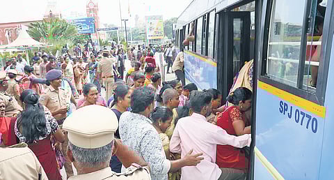 The sanitary workers being taken on a bus before being detained in various community halls in the city
