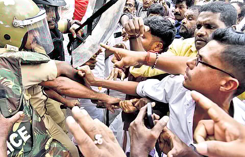 Police block BJP workers during a protest march to Pathanamthitta Mini Civil Station on Friday, demanding the arrest of the culprits in the Sabarimala
gold-plating case