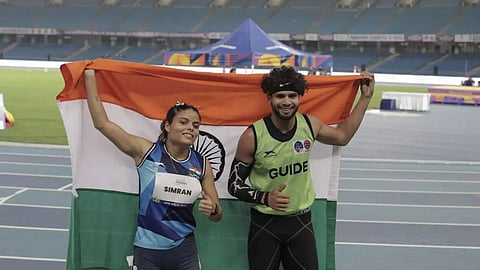 Simran Sharma with her guide Umar Saifi