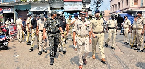 Police conduct a flag march in Cuttack on Friday