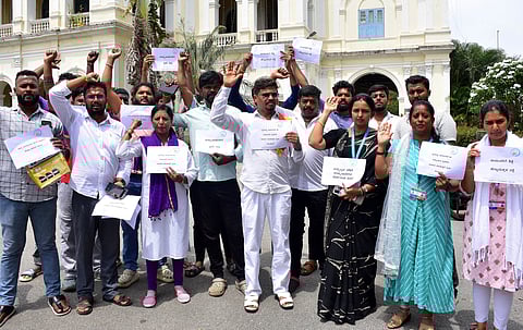 Gandhadagudi Foundation activists held protest against the rape and murder of a minor girl in Mysuru on Friday.