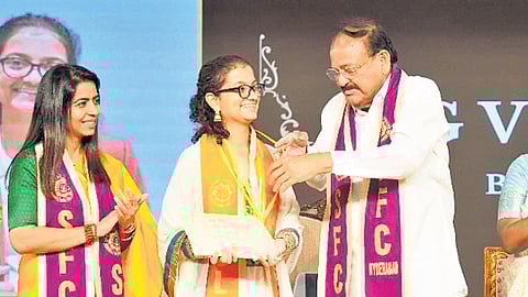 Former V-P M Venkaiah Naidu confers a degree to a student of St Francis College for Women in Hyderabad on Saturday