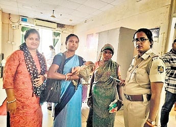 Police handed over the two-day-old baby boy to his mother