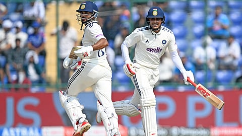 India's captain Shubman Gill (R) and his teammate Nitish Kumar Reddy run between the wickets during the second day of the second and last Test cricket match between India and West Indies at the Arun Jaitley Stadium in New Delhi on October 11, 2025.