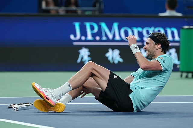 Arthur Rinderknech of France reacts after defeating Daniil Medvedev of Russia in their men's singles semifinal match of the Shanghai Masters tennis tournament at Qizhong Forest Sports City Tennis Center, in Shanghai, China, Saturday, Oct. 11, 2025.