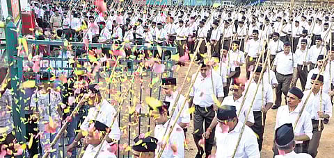 RSS volunteers take part in a ‘Path Sanchalan’ programme to mark the organisation’s centenary year in Bengaluru on Sunday