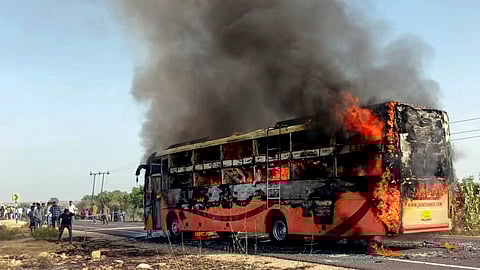 A bus traveling from Jaisalmer to Jodhpur catches fire, near Thaiyat village in Jaisalmer district, Rajasthan, Tuesday, Oct. 14, 2025.