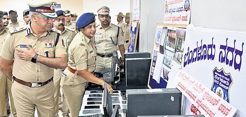 Police Commissioner Seemant Kumar Singh inspects seized items.